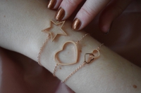 Armbandje dubbel hartje geweven goud kleur
